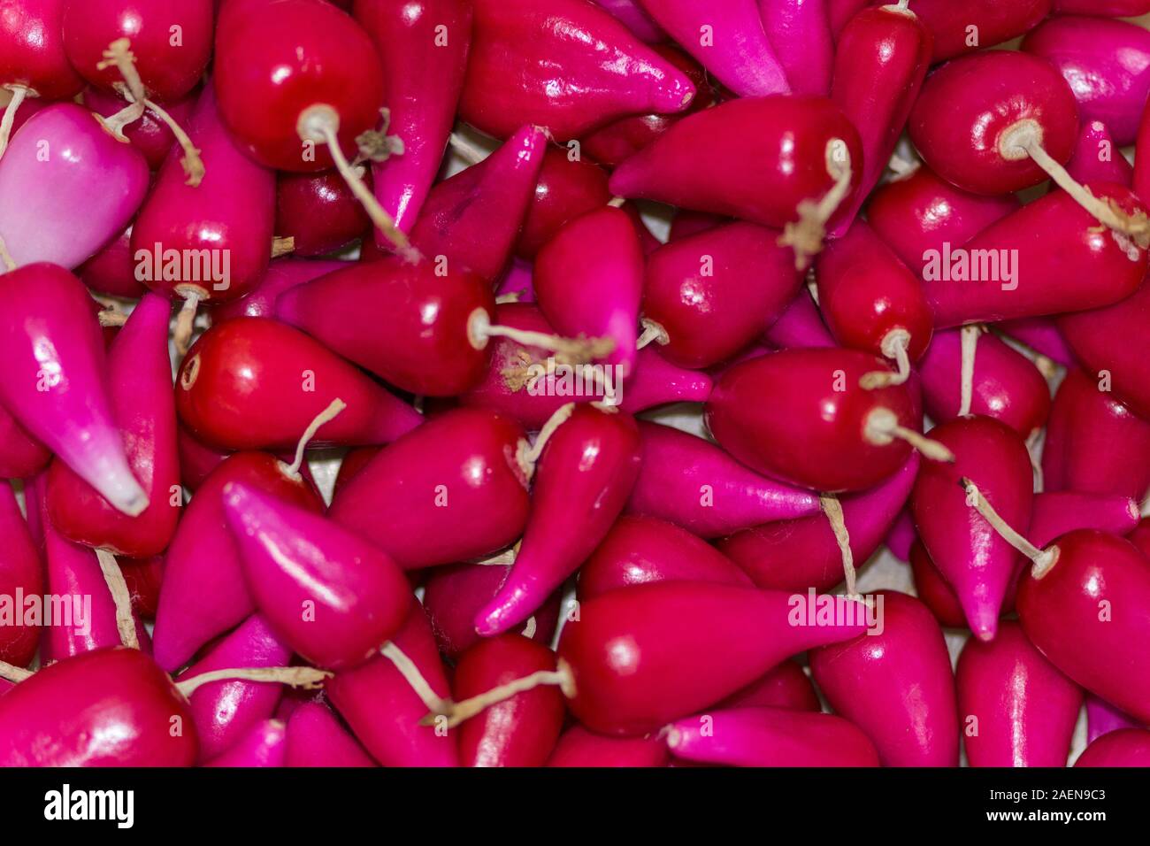 Gruppo Pitiguey frutta tropicale rosa fresca in mercato Foto Stock