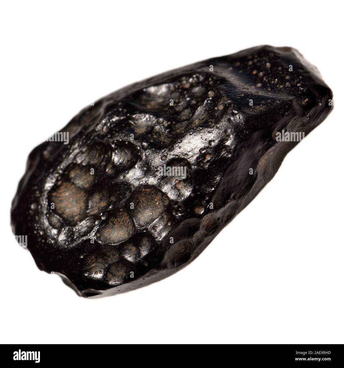 Indochinite /Tektite - metamorfico di vetro formata da rocce terrestri dopo fusione meteorite impatto e rapido raffreddamento Foto Stock