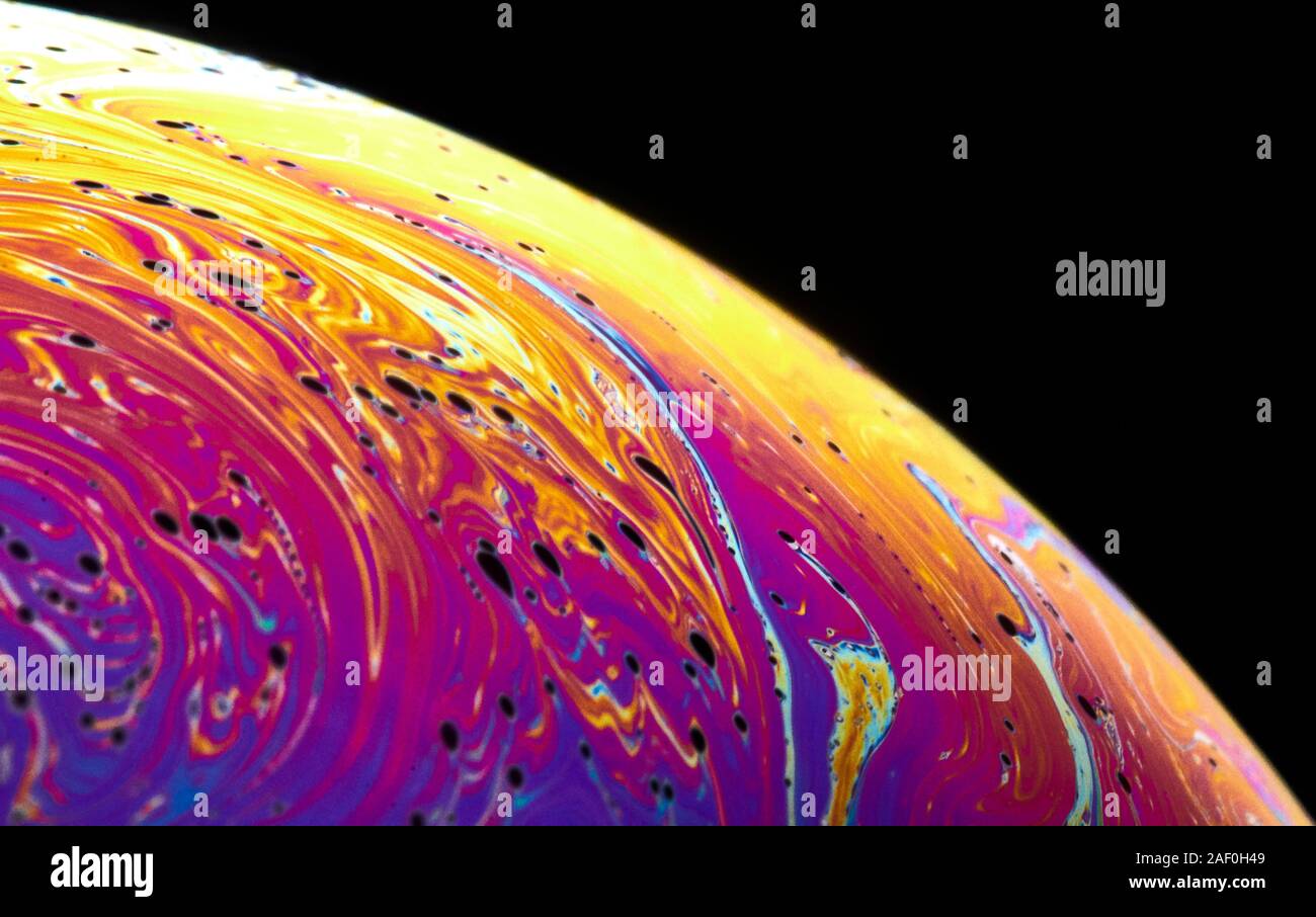 Ripresa macro di una bolla di sapone la simulazione di un pianeta Foto Stock