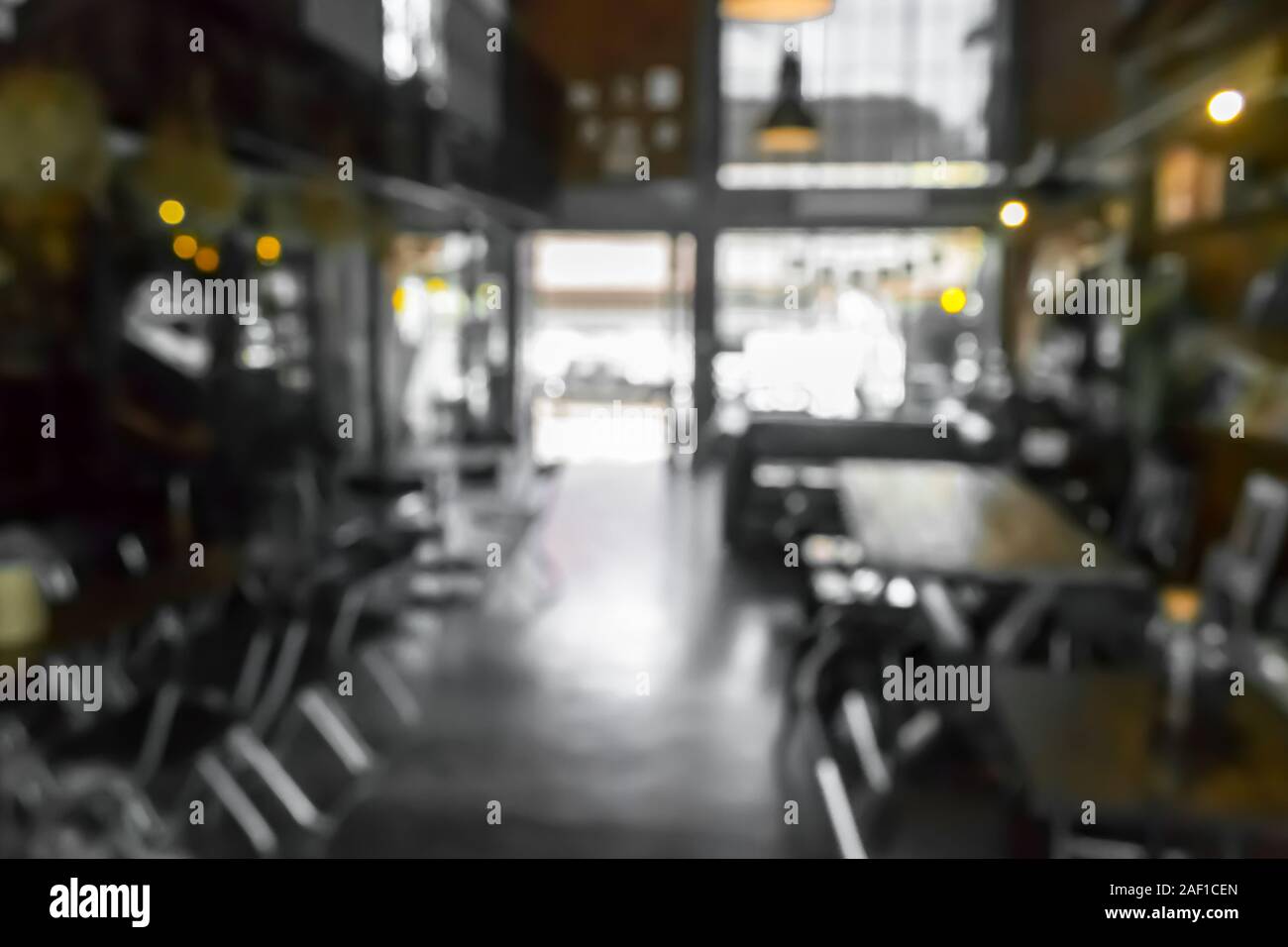Cafe la sfocatura dello sfondo bokeh di fondo con luce. Ristorante abstract blur. Foto Stock