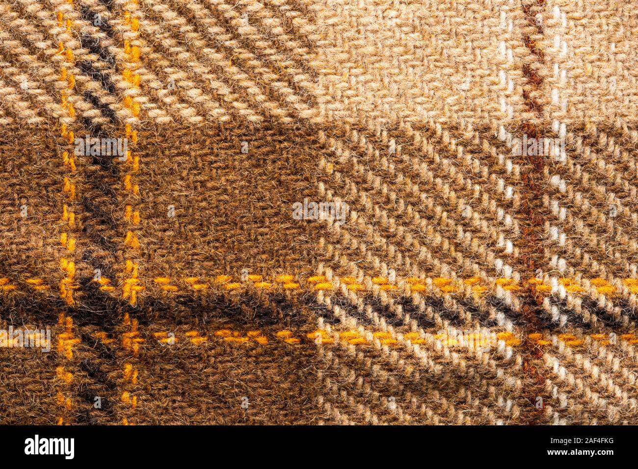 Controllare marrone tessuto. Lana scozzese. Tessuto per rivestire i plaid tuta. Close-up. Sfondo Foto Stock