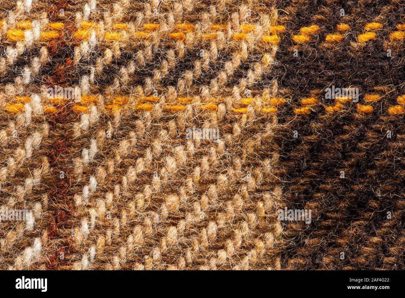Controllare marrone tessuto. Lana scozzese. Tessuto per rivestire i plaid tuta. Close-up. Sfondo Foto Stock