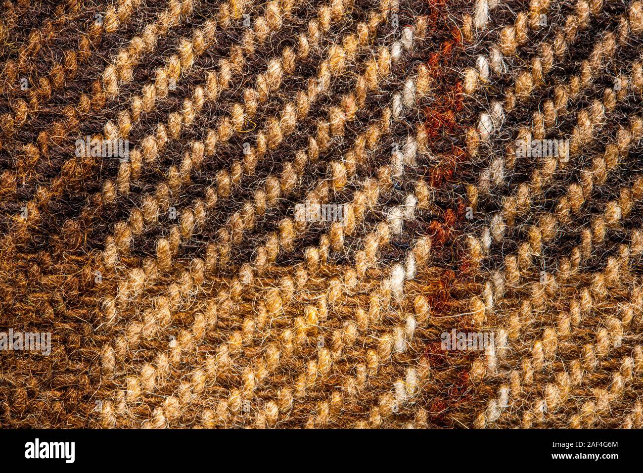 Controllare marrone tessuto. Lana scozzese. Tessuto per rivestire i plaid tuta. Close-up. Sfondo Foto Stock