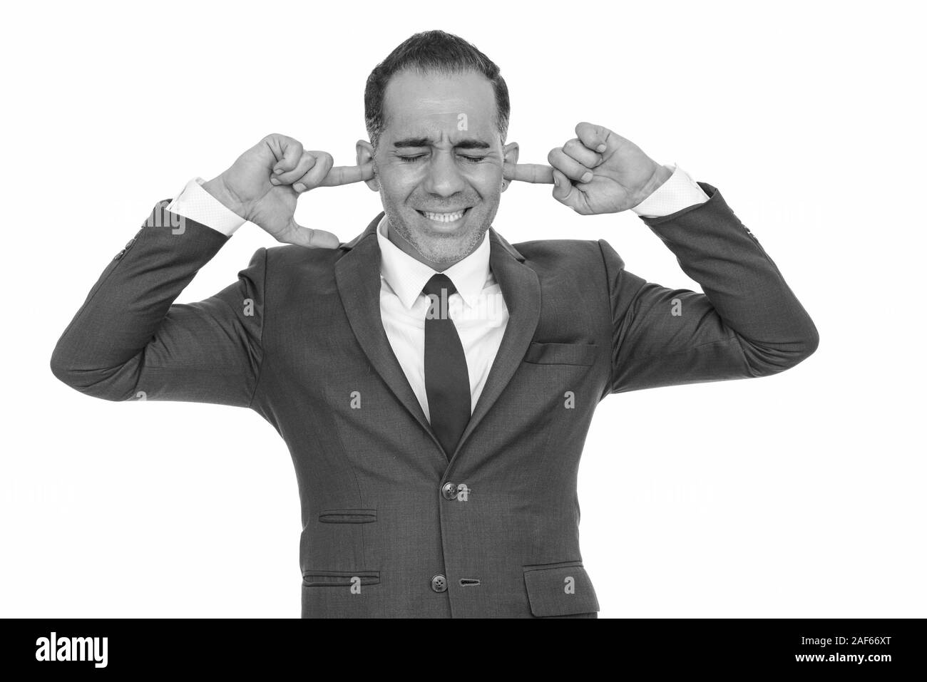 Coppia bello imprenditore persiano che copre le sue orecchie Foto Stock