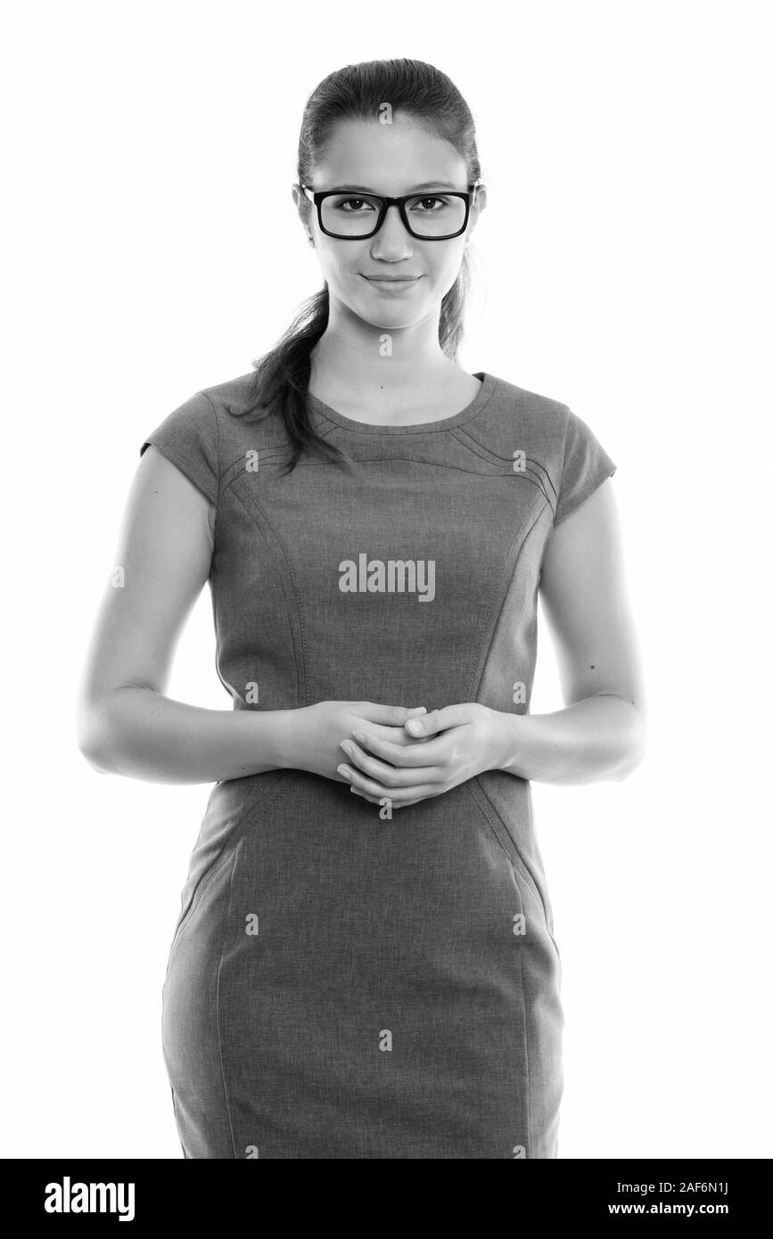 Studio shot del giovane bella imprenditrice indossando occhiali con le mani insieme Foto Stock