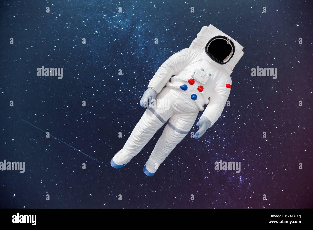 Tuta spaziale nello spazio lo sfondo con il posto vuoto per il viso. Foto Stock