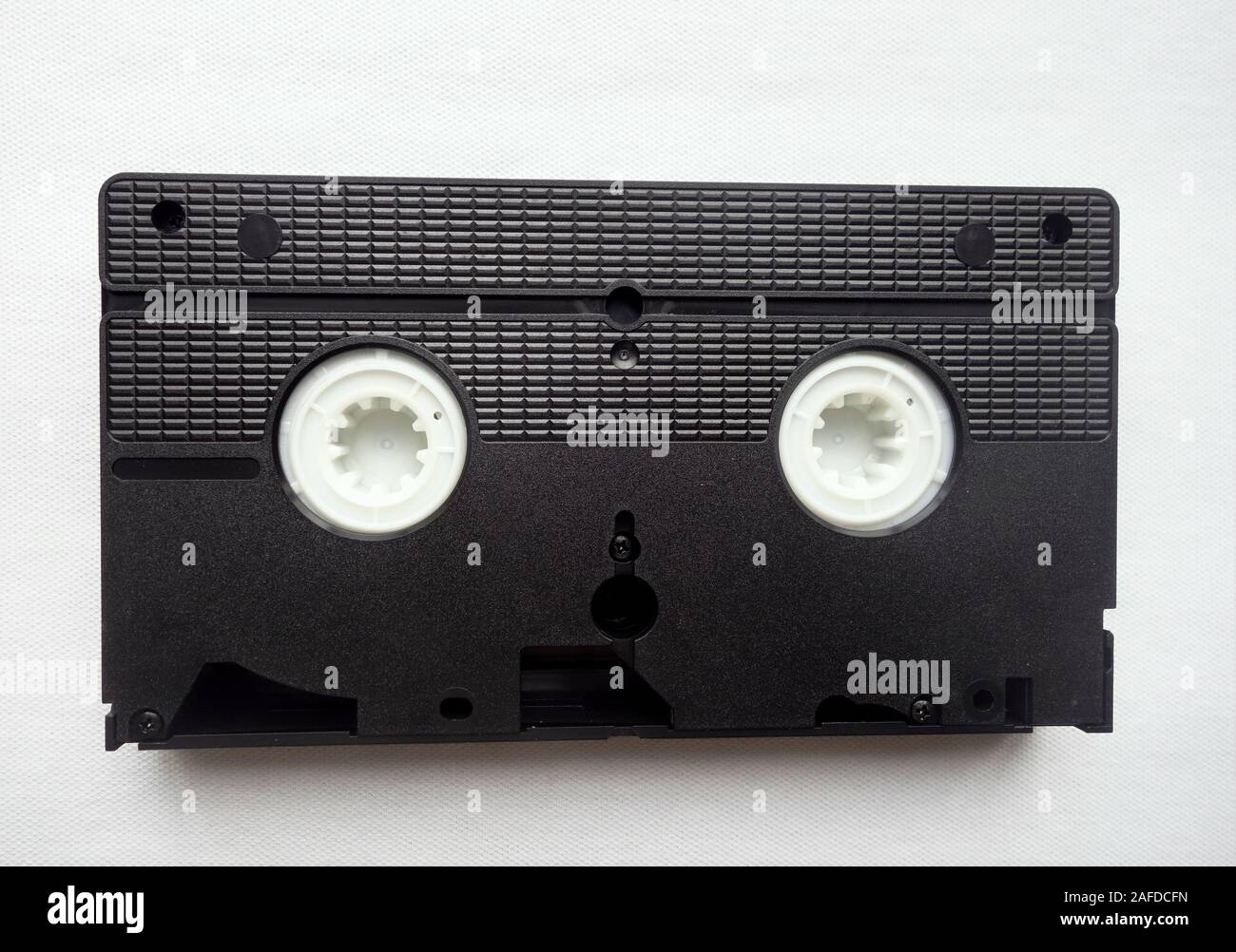 Inversione di un VHS (Video Home System) il nastro per videocassette che mostra il meccanismo dello stelo Foto Stock