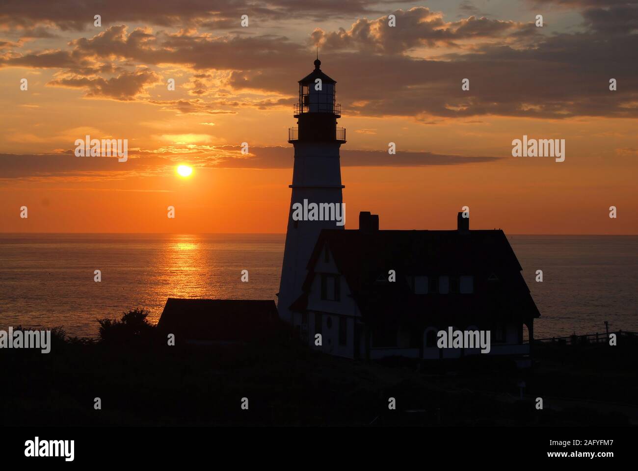 Sunrise presso il faro di Portland Foto Stock