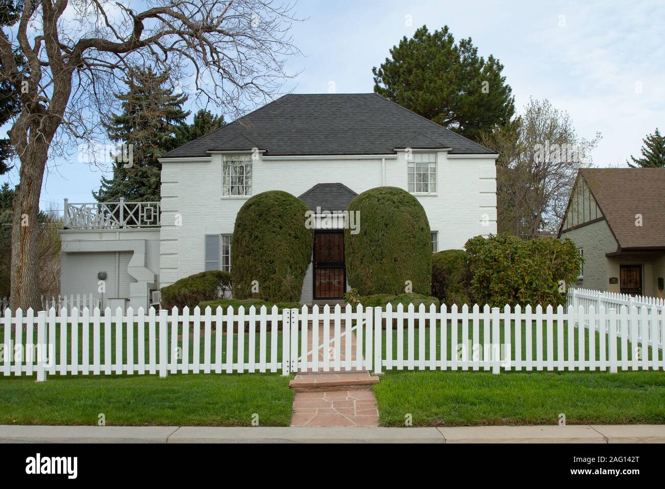 Casa di lusso con White Picket Fence Foto Stock