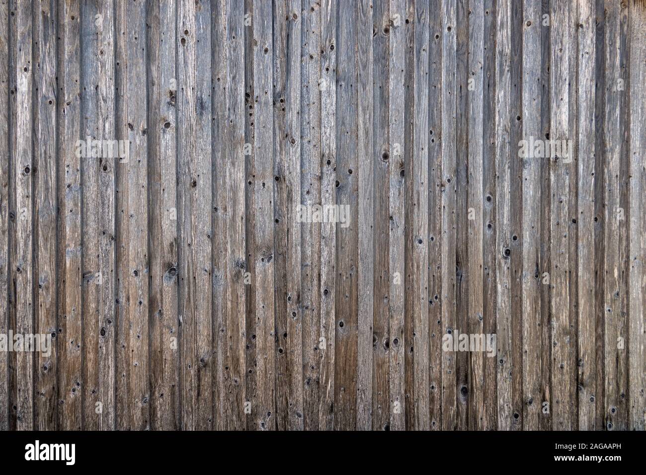 Rustico in legno vecchio muro di una stalla Foto Stock Rustico in legno vecchio muro di una stalla Foto Stock