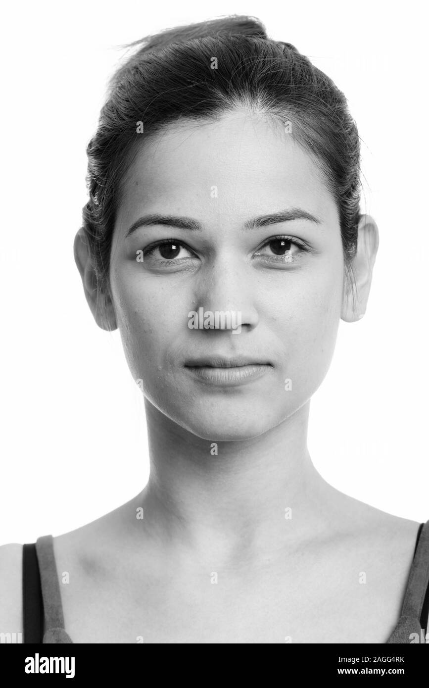 Volto del giovane bella donna con capelli legati Foto Stock