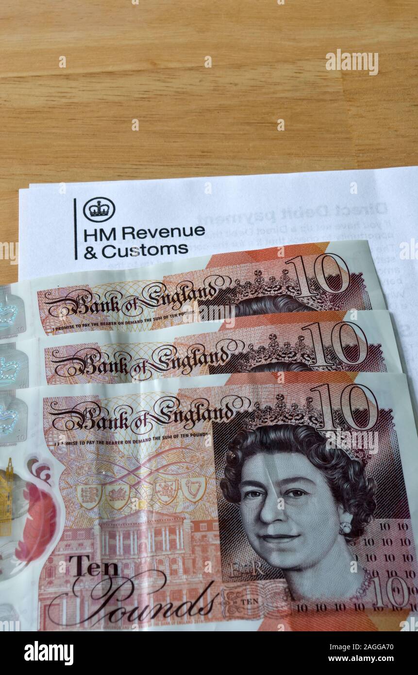 HM Revenue e dogana con Sterling denaro contante, REGNO UNITO Foto Stock
