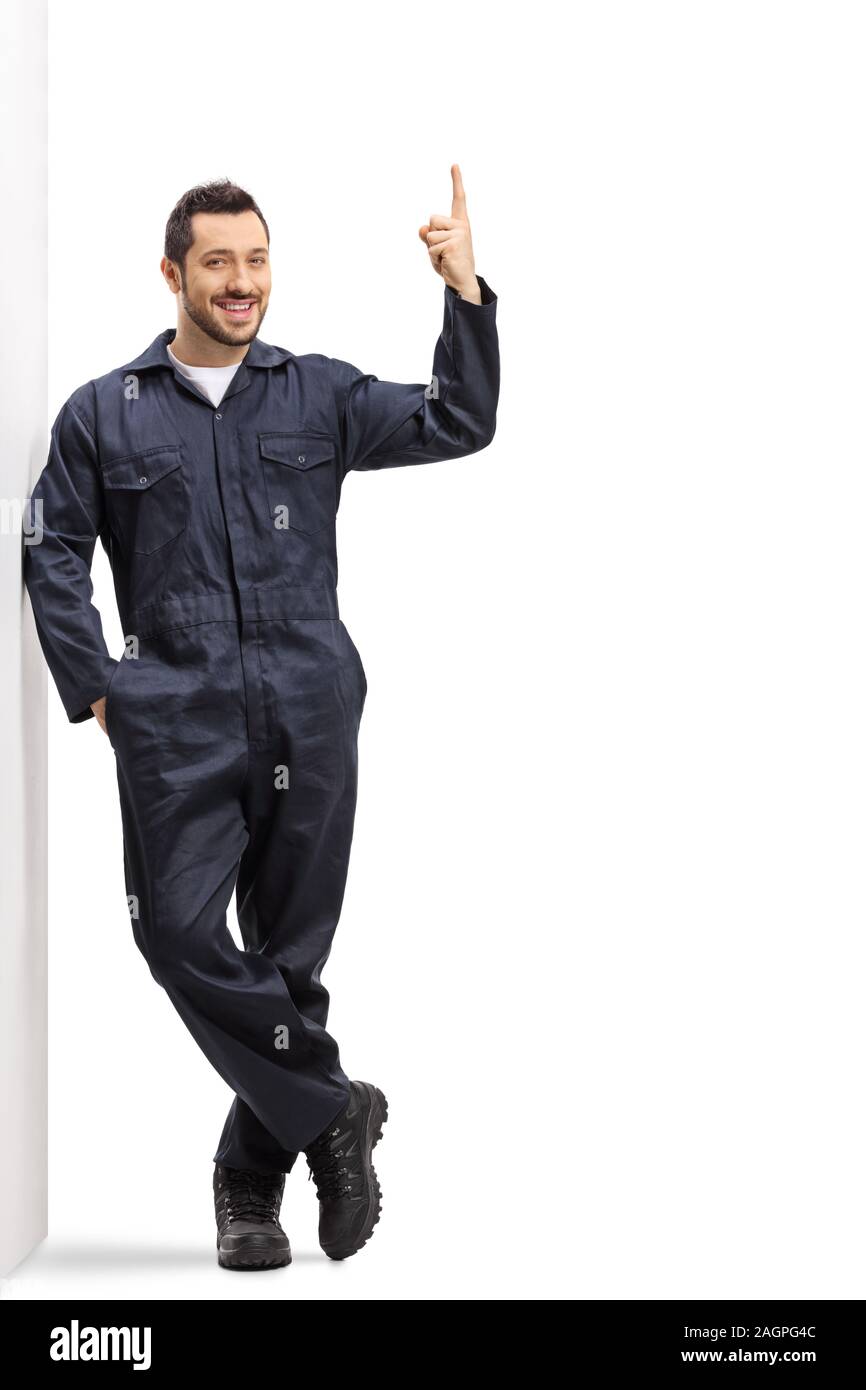 A piena lunghezza Ritratto di un lavoratore in una complessiva uniforme verso l'alto isolato su sfondo bianco Foto Stock