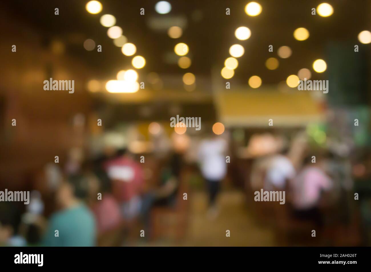 Ristorante la sfocatura dello sfondo bokeh di fondo con luce. Cafe abstract blur. Foto Stock