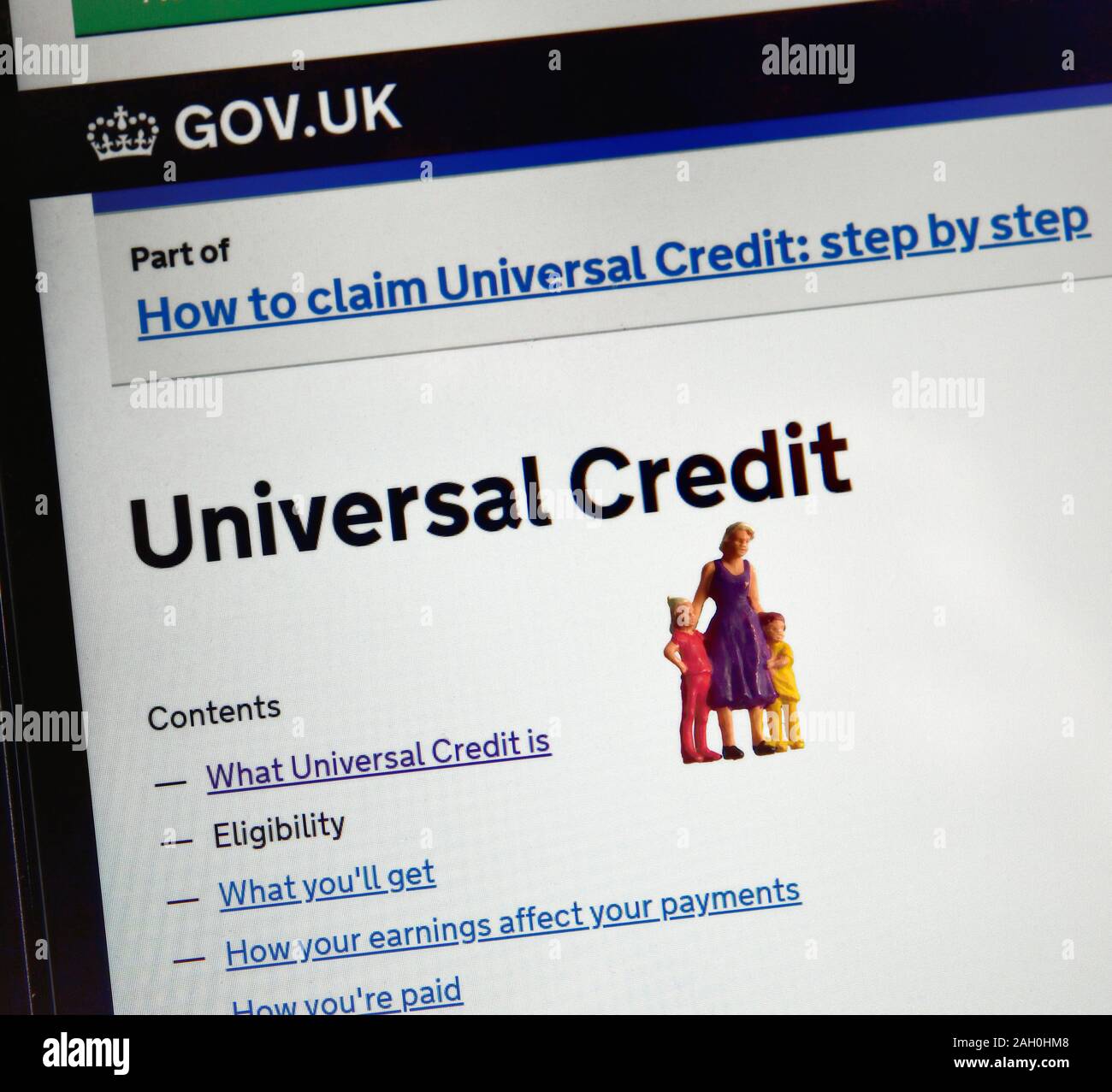 Credito Universale Gov.UK sito web pagina con statuine in miniatura aggiunto Foto Stock