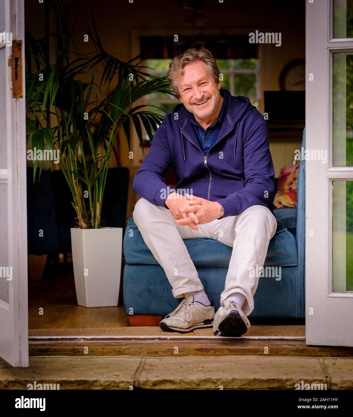 TV personality Tommy Boyd al suo West Sussex home. Foto Stock