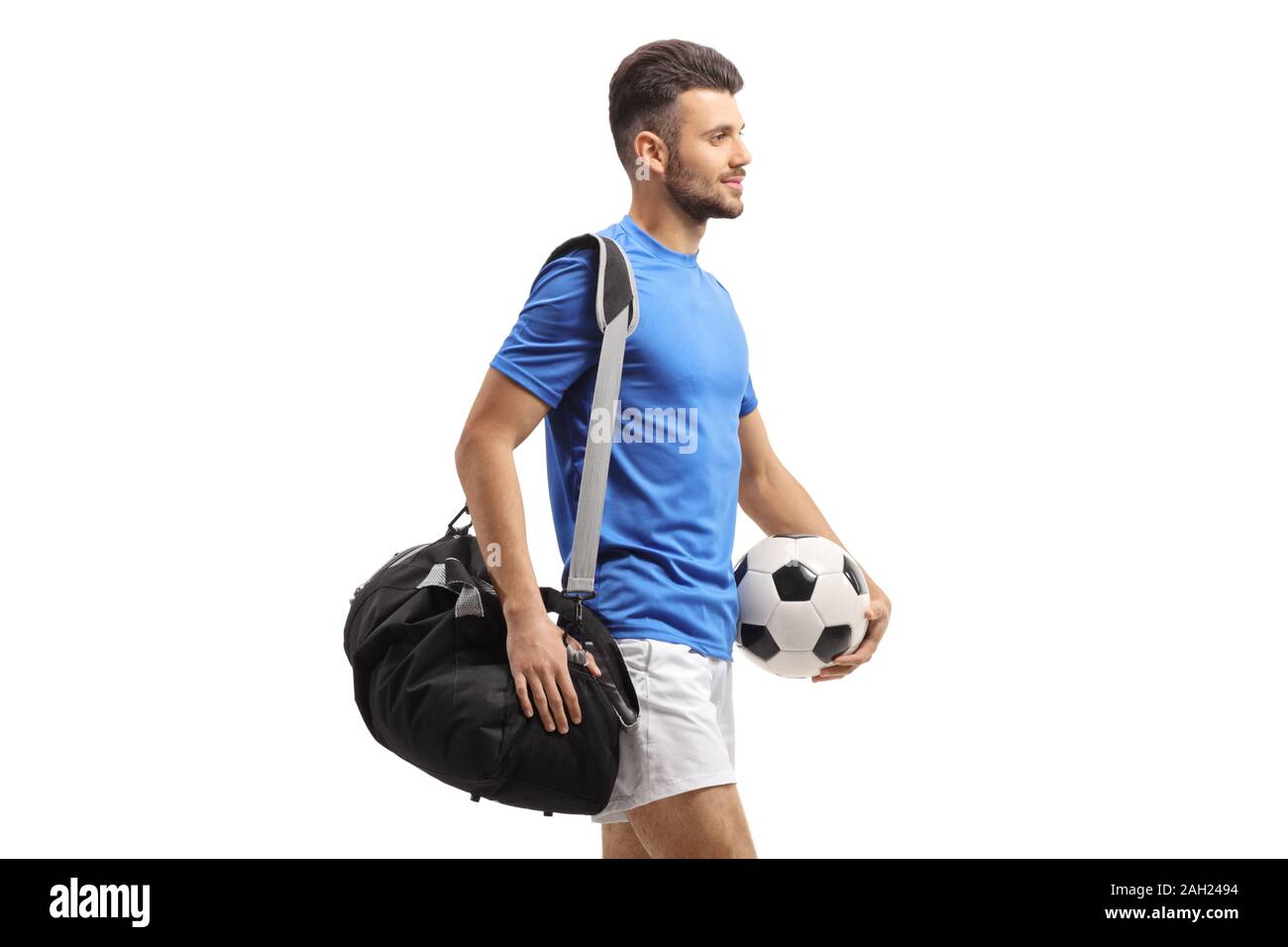 Giocatore di calcio con una borsa e un isolato di calcio su sfondo bianco Foto Stock