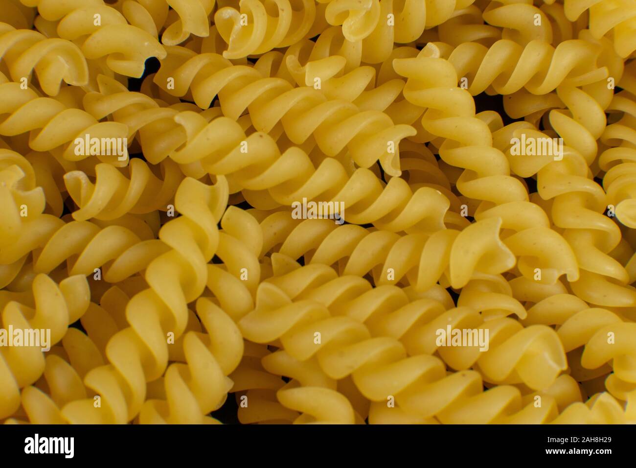 Sfondo formato da una forma a spirale la pasta Foto Stock