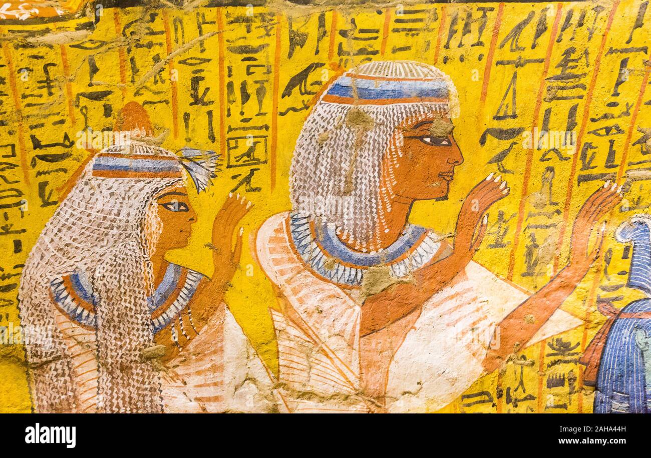 Patrimonio Mondiale dell'UNESCO, Tebe in Egitto, Deir el Medineh, tomba di Irynefer, un paio di pregare. Essi notevole usura parrucche bianche. Foto Stock