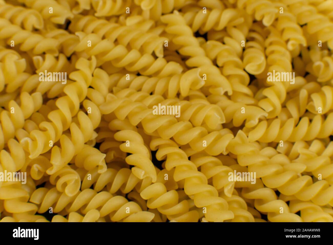 Sfondo formato da una forma a spirale la pasta Foto Stock