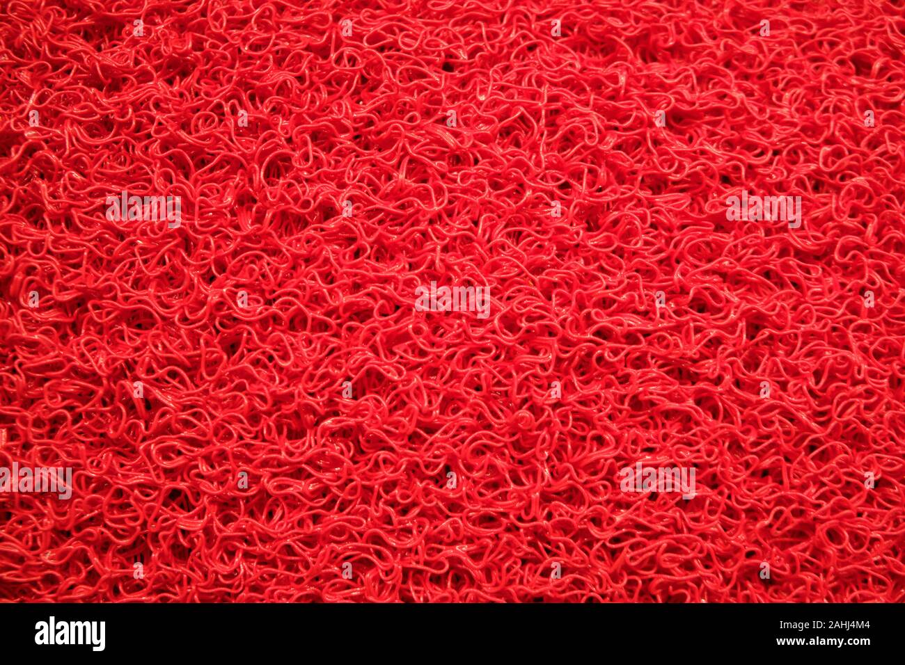 Rosso sintetico pavimento in moquette texture di sfondo o concetto. Foto Stock