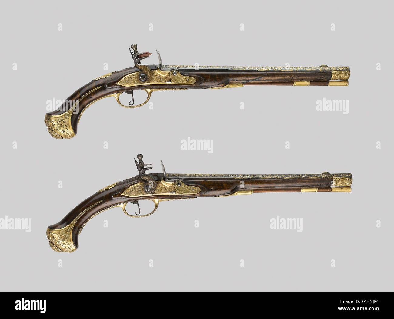 Coppia di custodia Flintlock Pistols. 1690-1720. A LIEGI. Noce, acciaio, ottone, e doratura Foto Stock