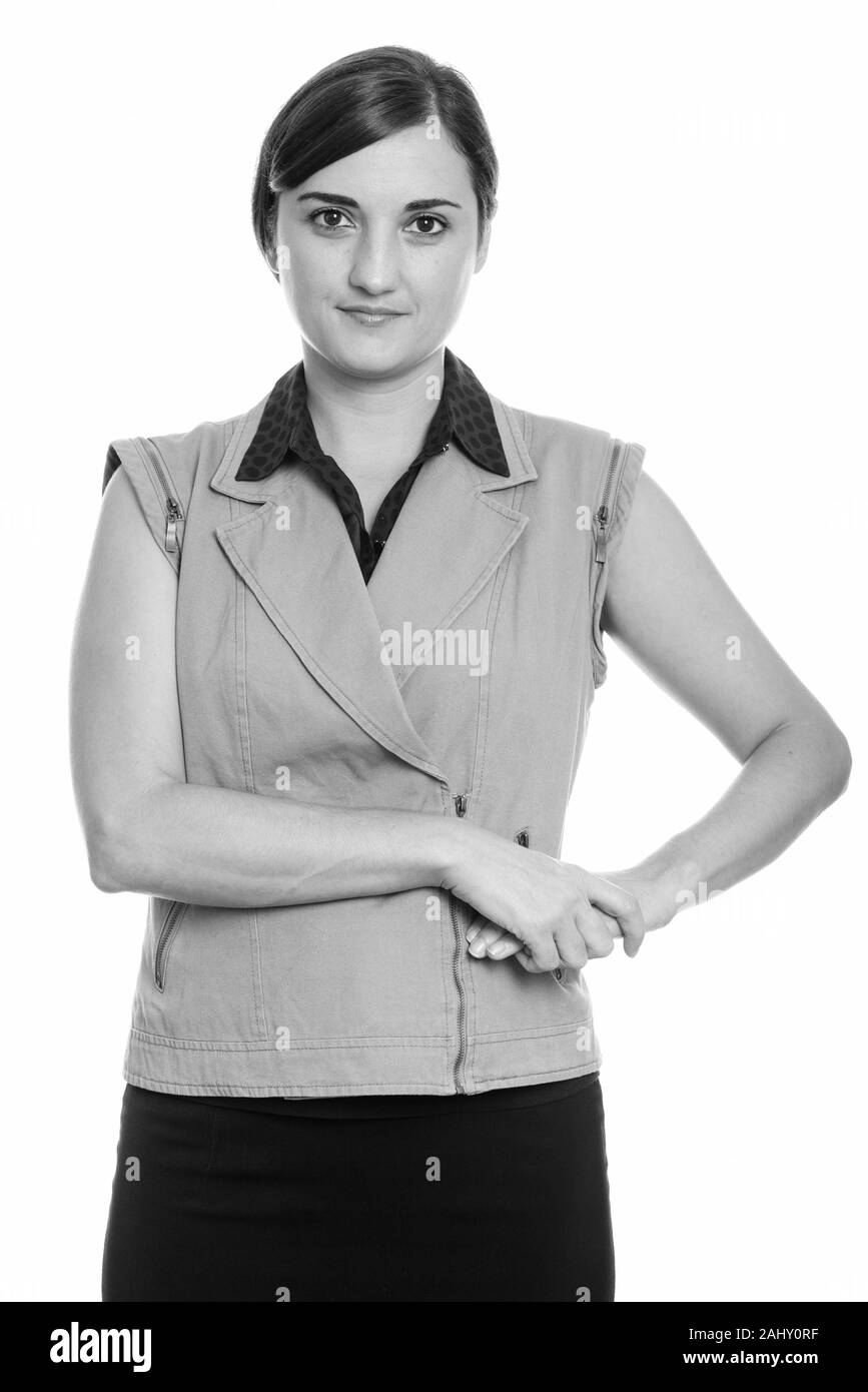 Studio shot di bella imprenditrice che posano con le mani sul hip Foto Stock