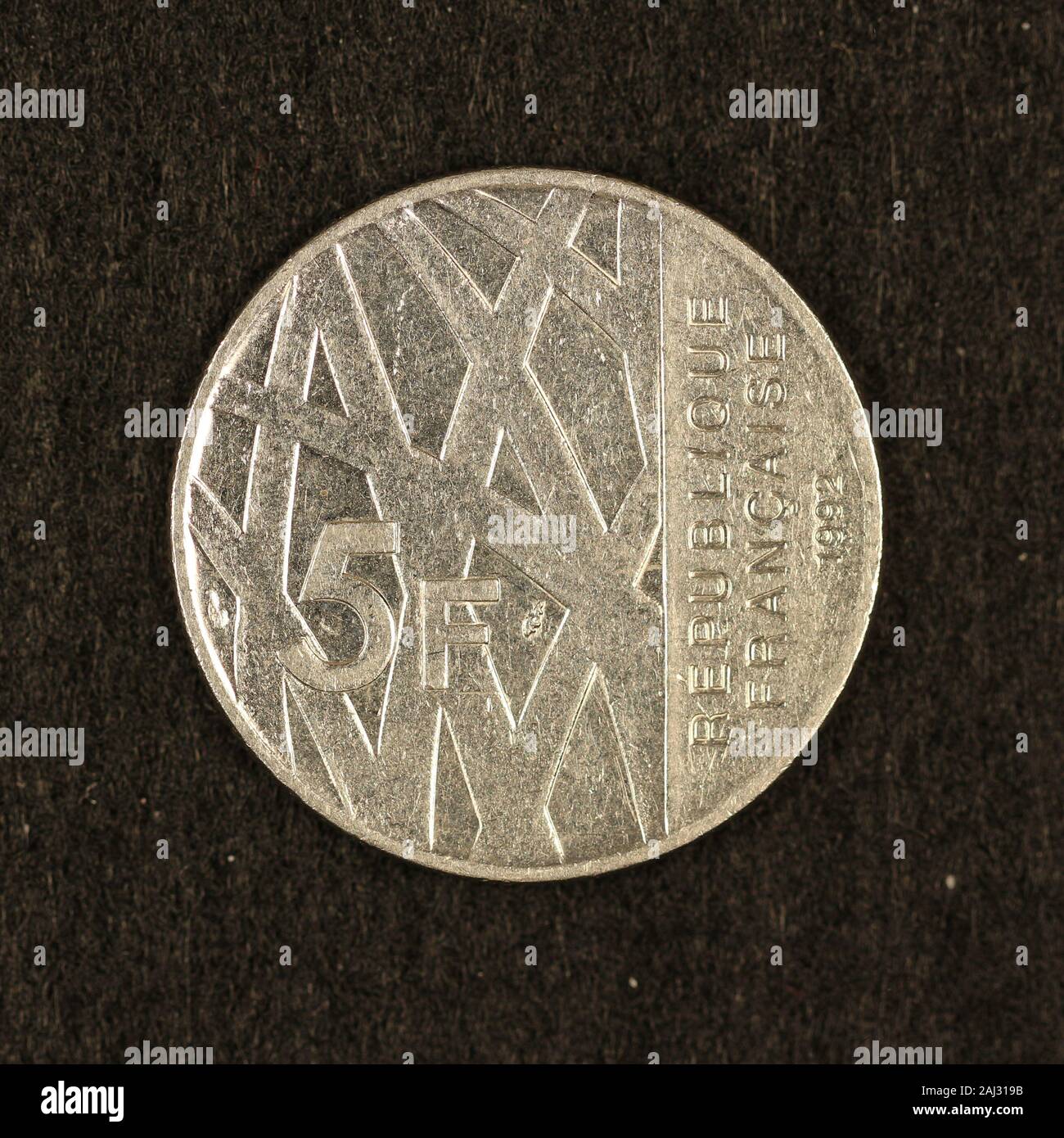 Vorderseite einer ehemaligen 5 franchi Münze Foto Stock