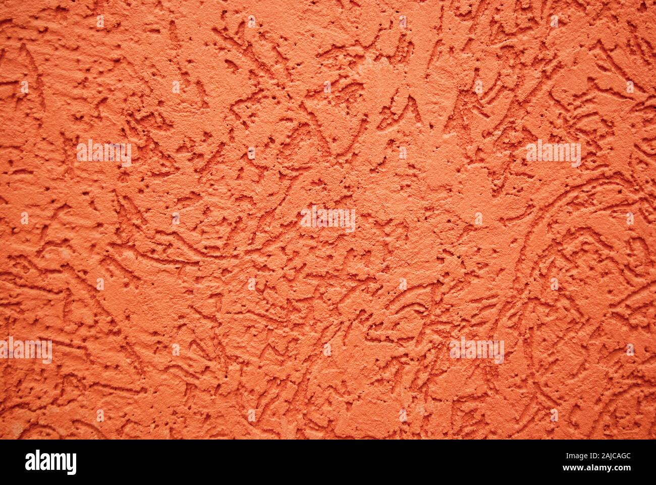 Arancione rossastro texture di sfondo dipinto di muro di pietra Foto Stock