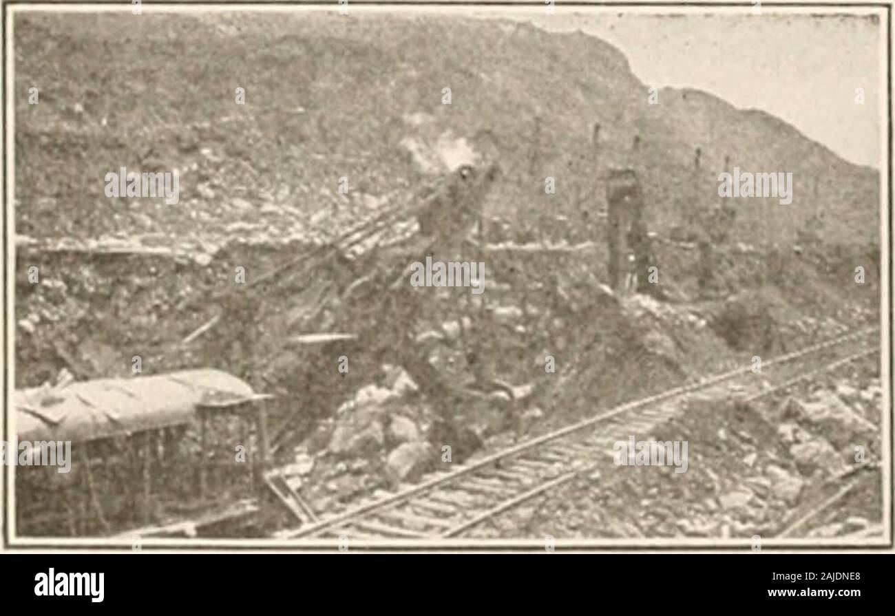 Il nostro paese e le sue risorse; . Foto Underwood & Underwood che soffia su una diga sul PANAMACANAL ping da denti in un rack. Essi areequipped con un verricello di traino,che consente la richiesta di pagare outand assunzione di hawser. L'acqua all'interno del blocco cham-ber corretto, al di là della entrancechamber, viene portato al livello ofthat nell'approccio, il gales a-ward la nave sono aperte, un tenderchain viene abbassata e la locomo-tives manovrare il recipiente in thechamber. I cancelli sono chiusi, leviti sollevata o abbassata a livellodell camera successiva, i cancelli a altre estremità sono aperte e il sistema VES-sel Foto Stock