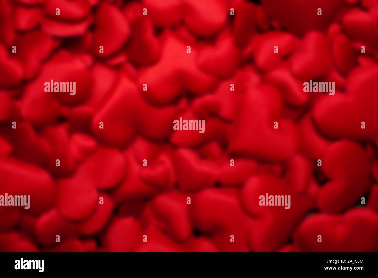 Rosso modello cuore sfocato Foto Stock