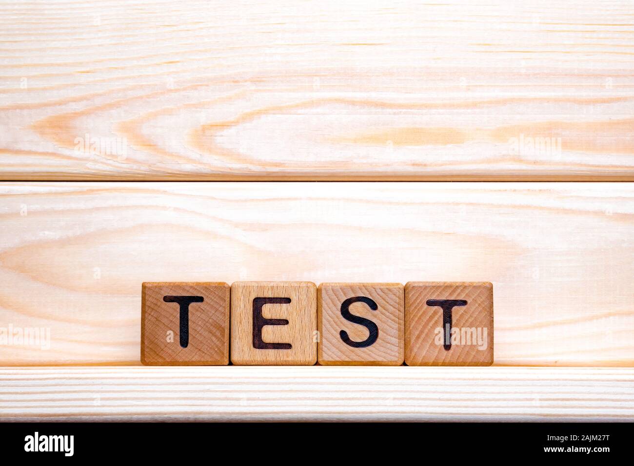 Test word made of wood background. Business concept. Test sign, exam, learning concept. Word test written with wooden cubes. Education quality control. Test background Foto Stock