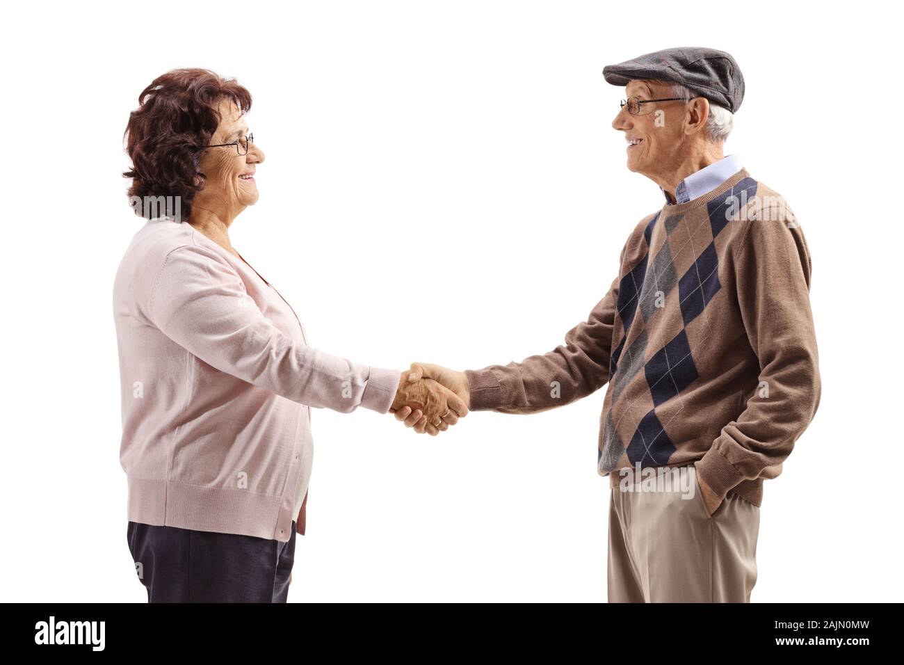 Anziani l uomo e la donna si stringono la mano isolati su sfondo bianco Foto Stock