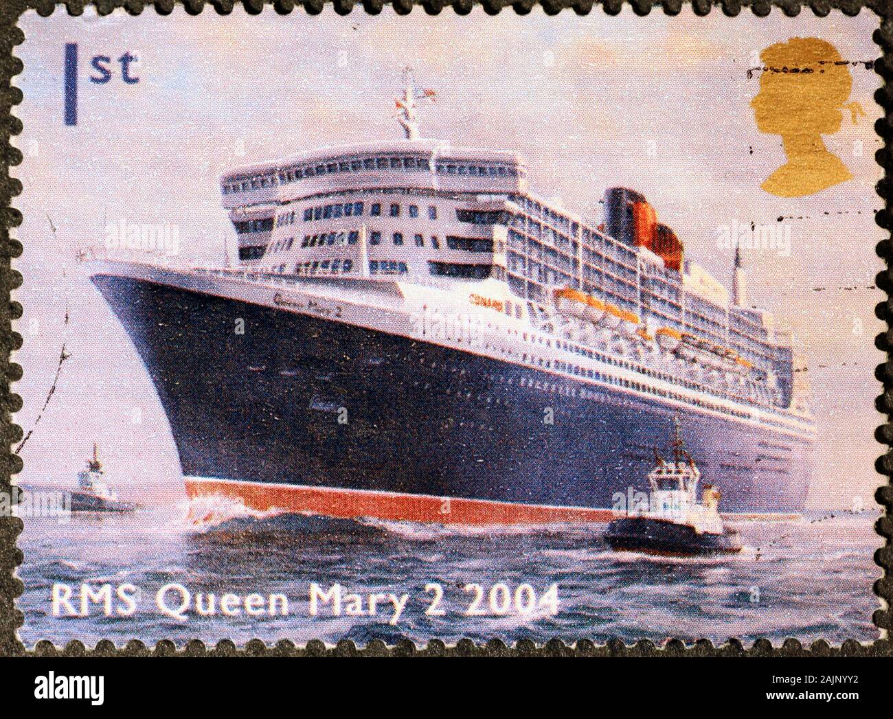 Autobus rosso a due piani con francobollo in inglese Foto Stock