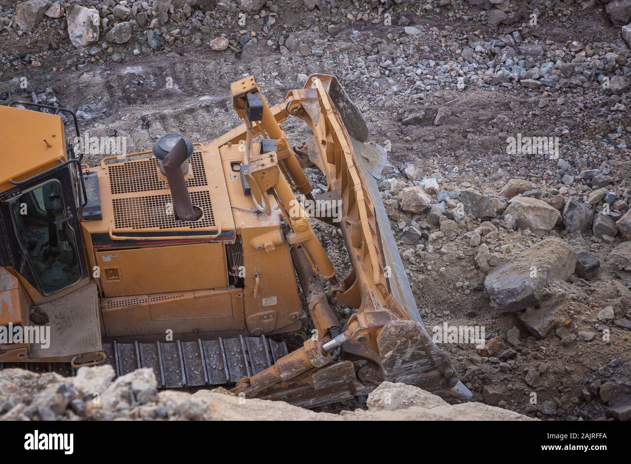 Macchinari per l'estrazione mineraria che lavorano su rocce Foto Stock