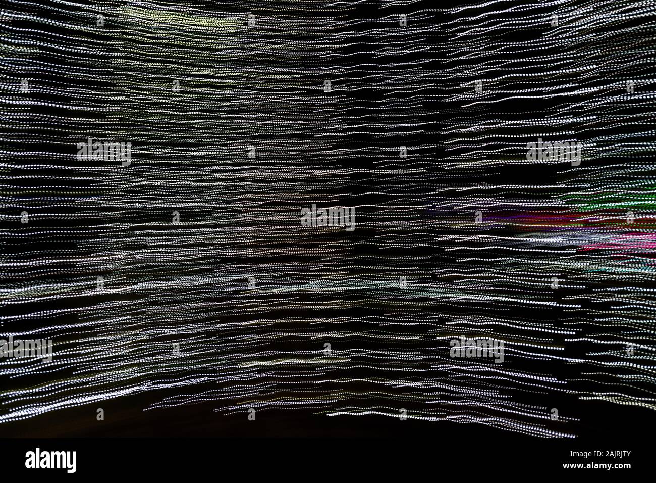 Luci di astratto in punti e trattini formare linee Foto Stock