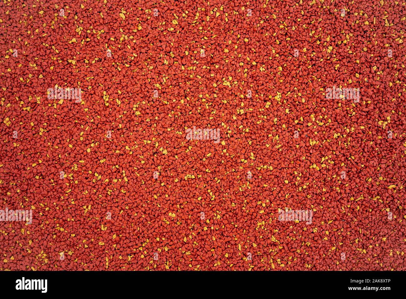 Arancione e gomma gialla ghiaia superficie texture Foto Stock