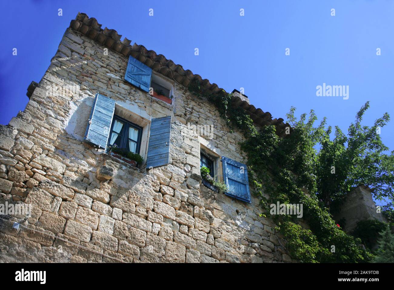 Casa di pietra, Grande Rue, Ansouis :, Vaucluse, Francia Foto Stock