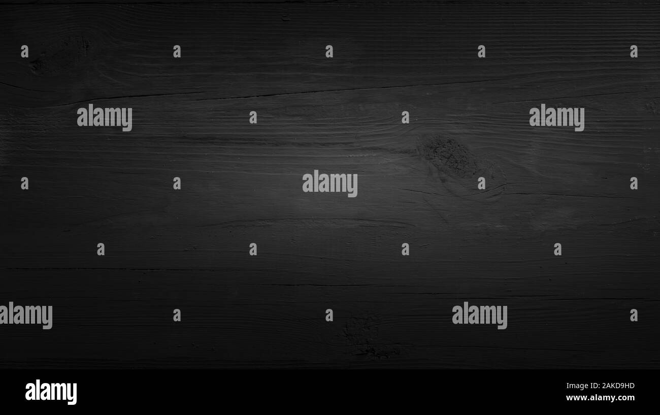 Il vecchio dipinto di nero la superficie di legno Foto Stock