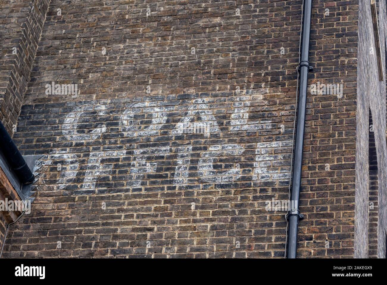 CAMDEN, Londra: il vecchio segno per il carbone Office su edificio vittoriano in stabile Street - parte di Kings Cross riqualificazione Foto Stock