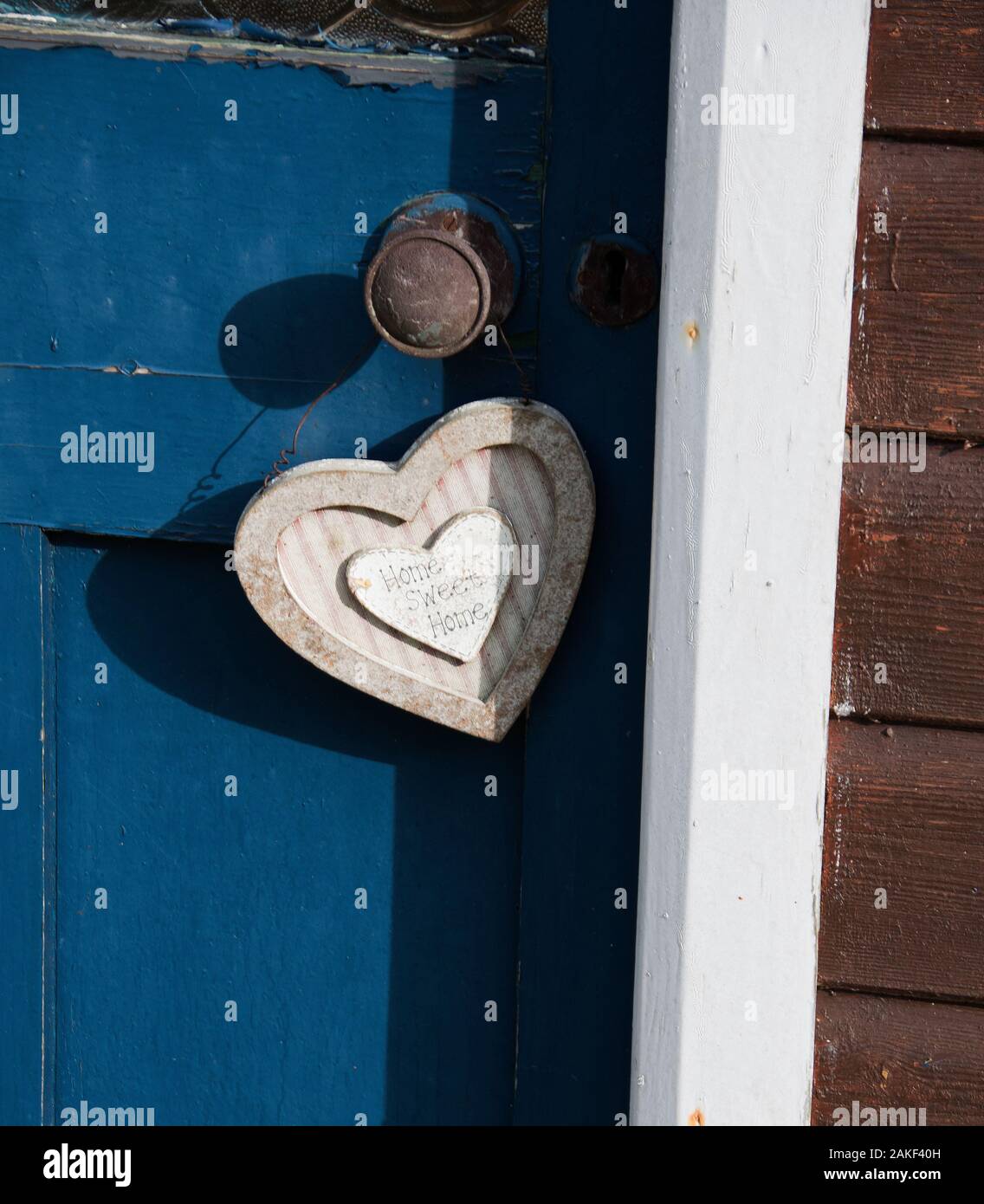 Home Sweet Home firma su una Wendy House Foto Stock