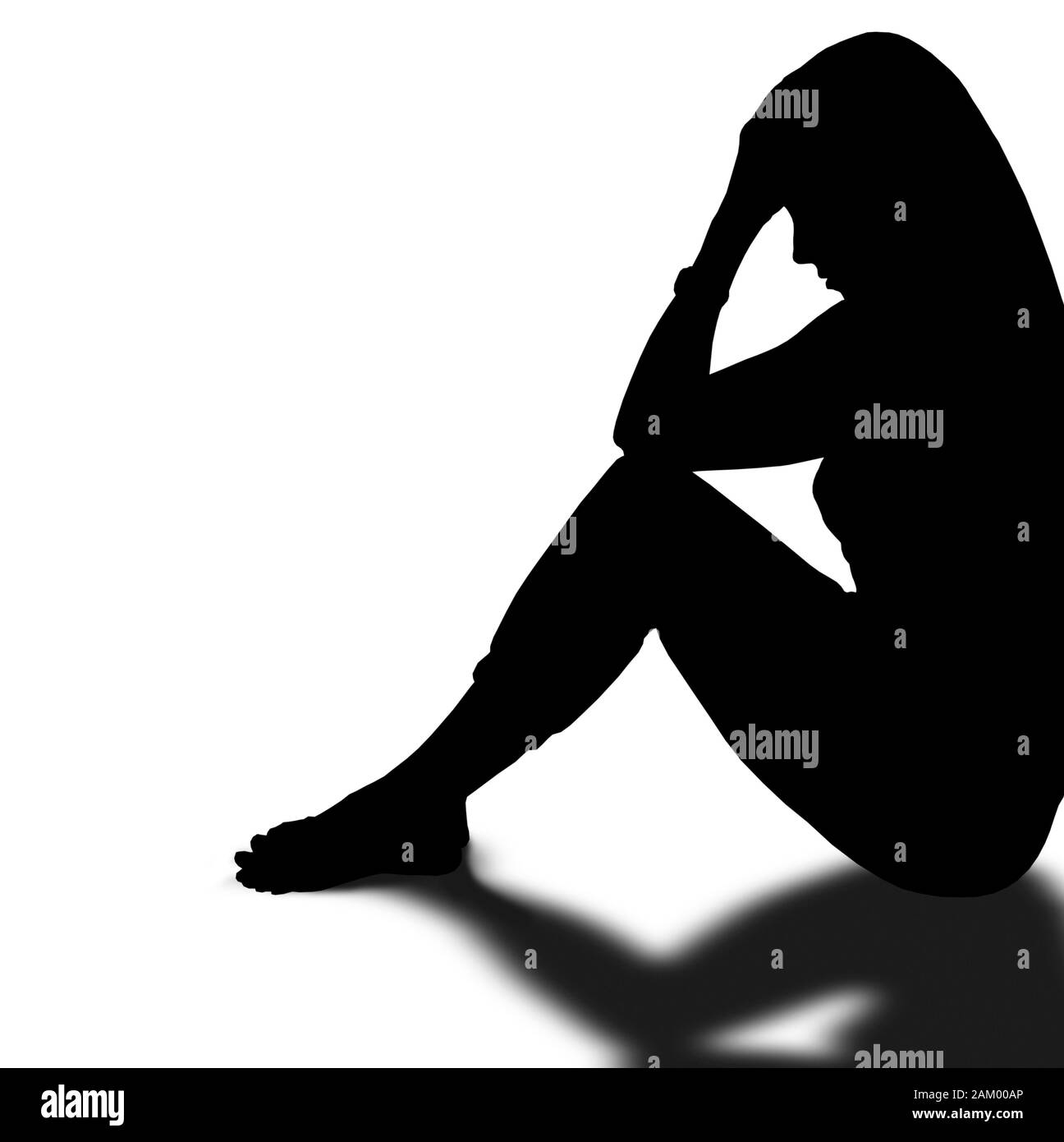 Donna seduta con testa in mano Foto Stock