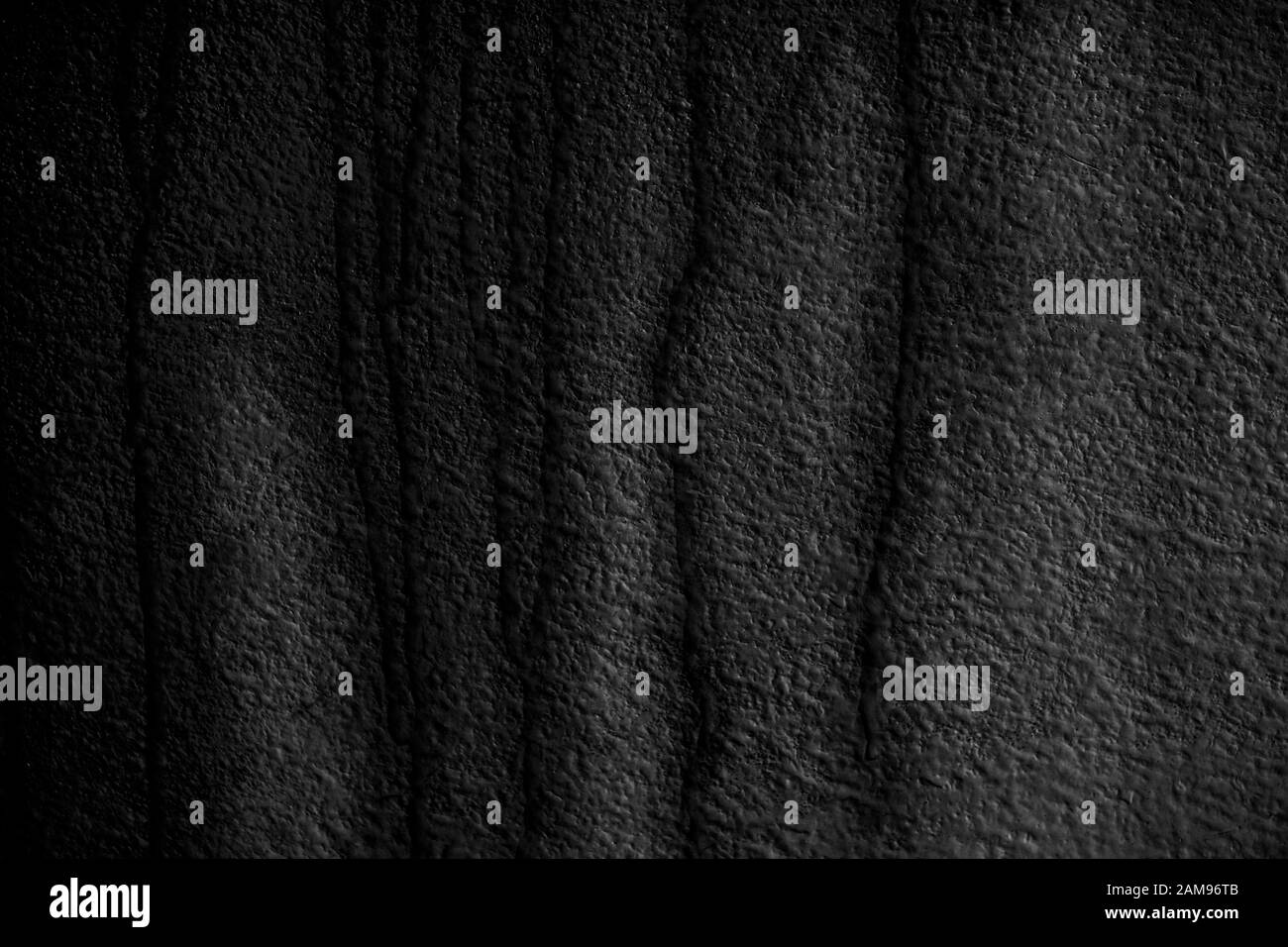 Colore grigio ruvido texture parete. Sfondo per design. Struttura di una vecchia parete grigia bagnata con gocce di pioggia. Foto Stock