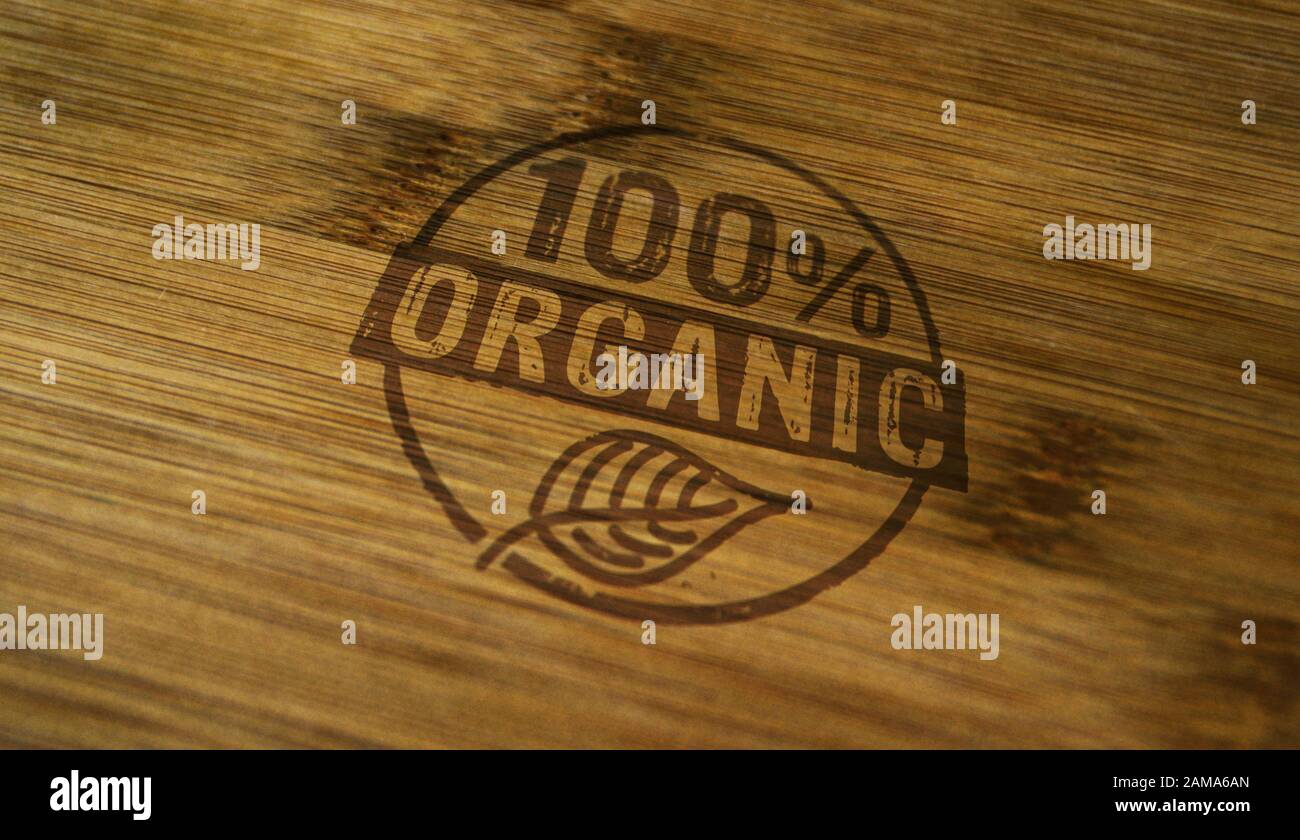Organico 100 per cento timbro stampato su scatola di legno. Ecologia, bio, ogm libero, naturale e sano concetto di dieta. Foto Stock