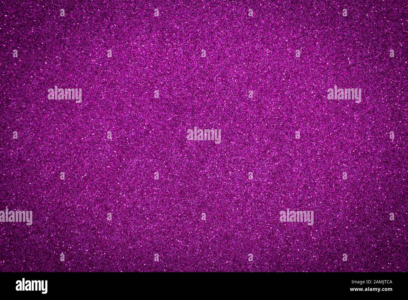 Luccicante glitter di fondo con texture viola. Sfondo di colore viola con effetto glitter. Foto Stock