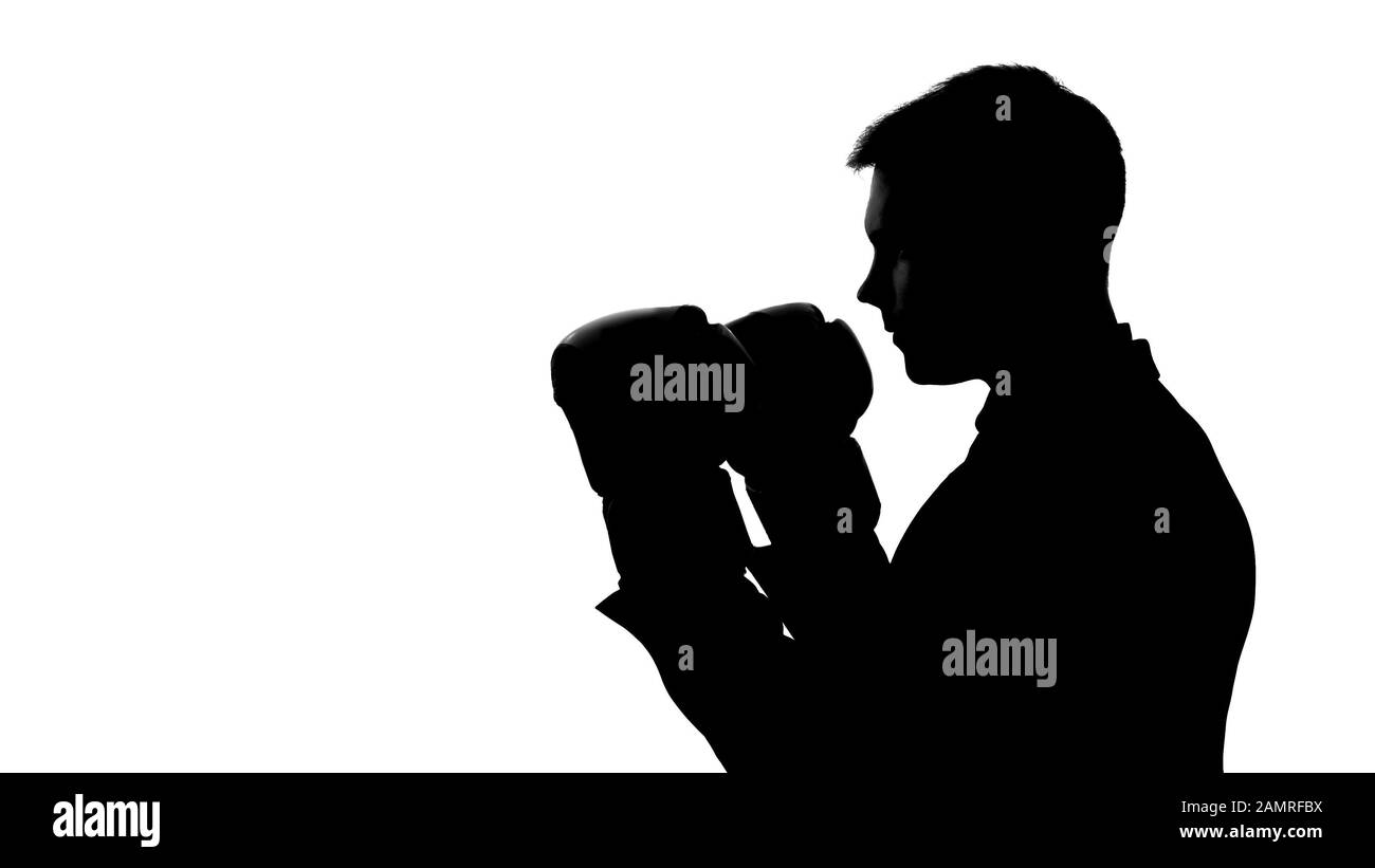 L'ombra dell'uomo nel business si adatta alla boxe con ombra, stress sollievo, modo di riflettere Foto Stock