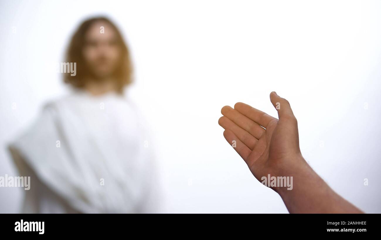 Padre accogliere Gesù Cristo in cielo, figlio di saluto e dando mano Foto Stock