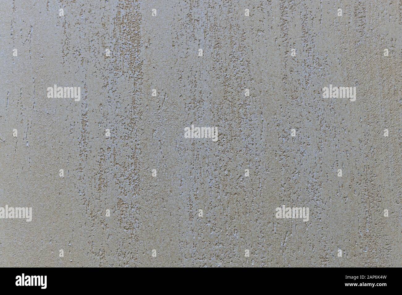 Beige con fondo in gesso neutro madreperla con rientranze ruvide all'interno e una struttura liscia verso l'esterno. Foto Stock