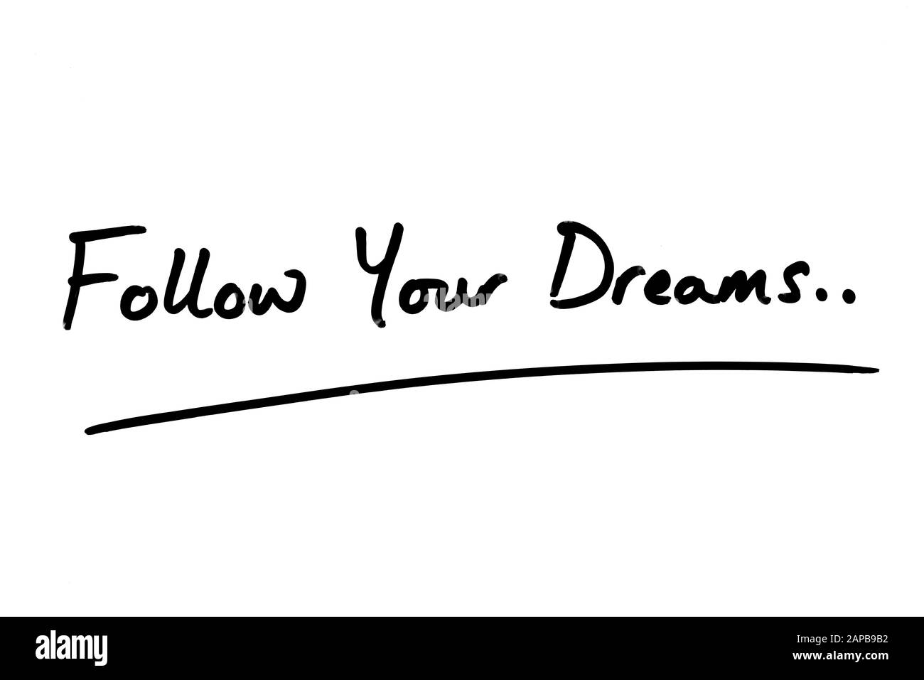 Segui i tuoi sogni.. Scritto a mano su uno sfondo bianco. Foto Stock