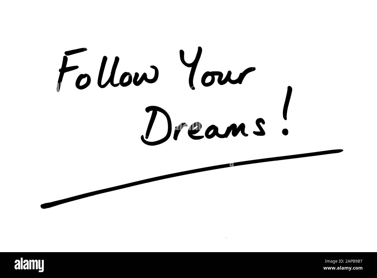 Segui I Tuoi Sogni! scritto a mano su sfondo bianco. Foto Stock